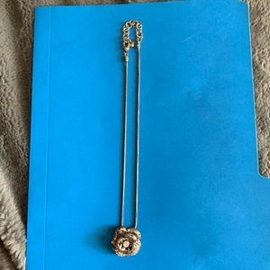 Brighton necklace with floral pendant.